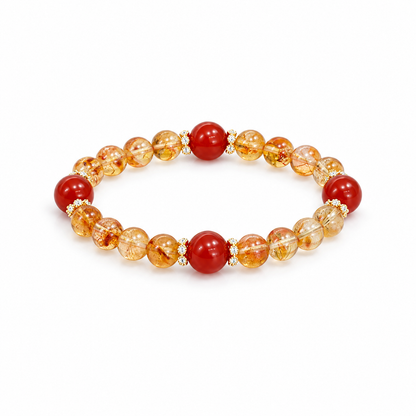 Golden quartz and red agate bracelet with floral spacers on white