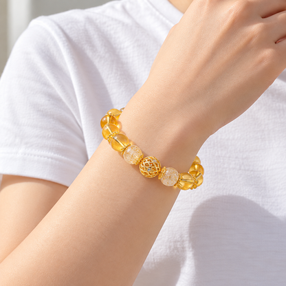 Side view of golden rutilated quartz and citrine bracelet