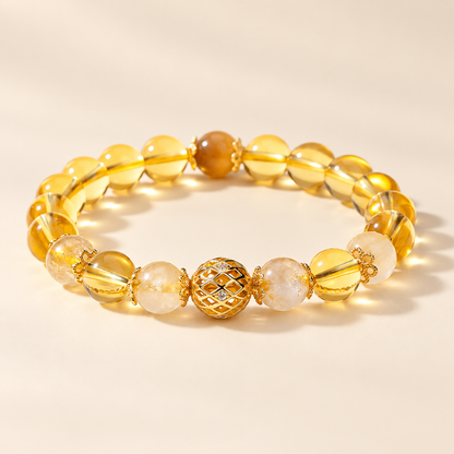 Three-quarter view of golden rutilated quartz and citrine bracelet