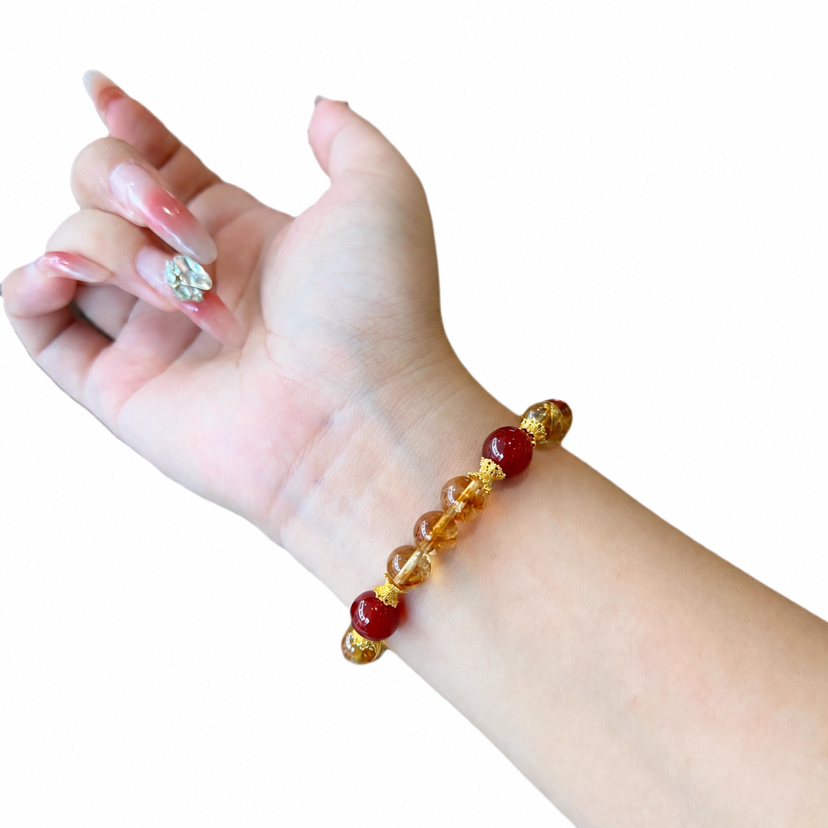 Classic golden quartz and red agate bracelet worn on wrist