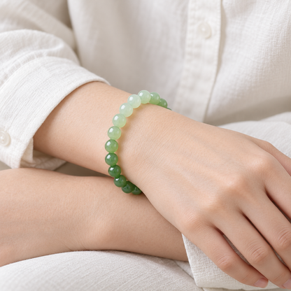 Gradient Hetian jade bracelet shown close-up on the wrist