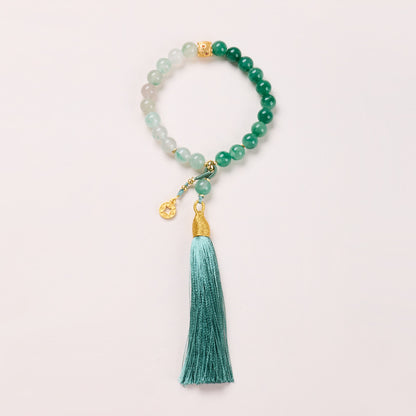 8mm green stone bracelet with coin charm and teal tassel