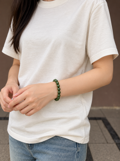 Green wood bead bracelet worn at front wrist view