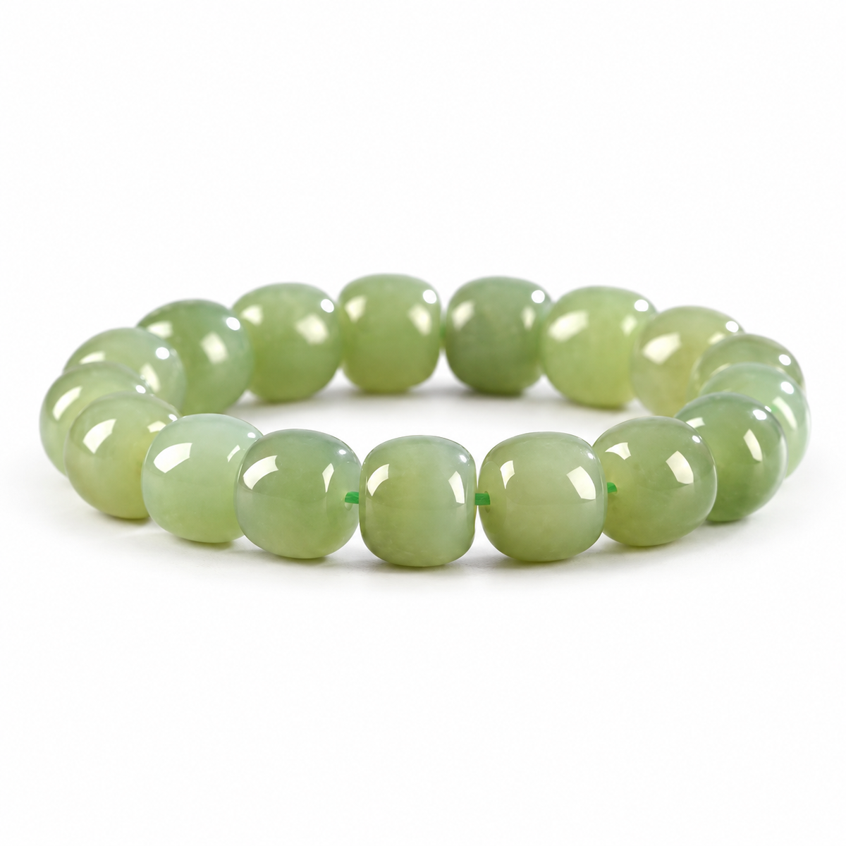 Pale green Hetian jade barrel bead bracelet on white