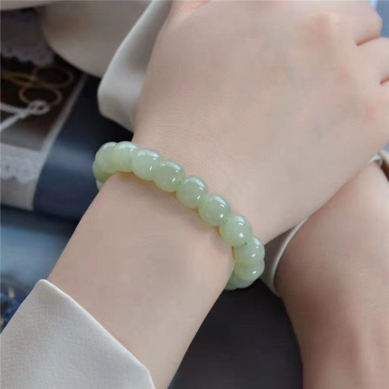 Hetian jade barrel bead bracelet on wrist
