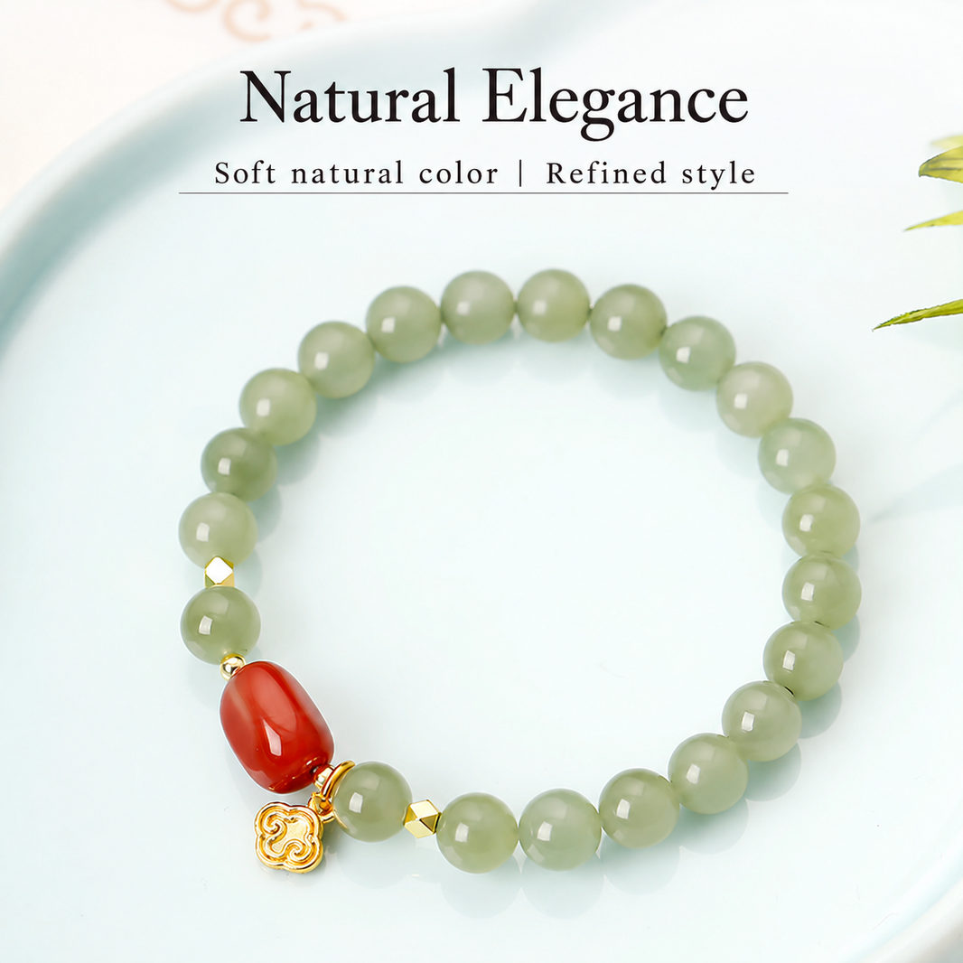 Pale green jade bracelet on a light plate