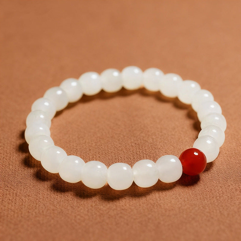 Hetian jade barrel bead bracelet with a red accent