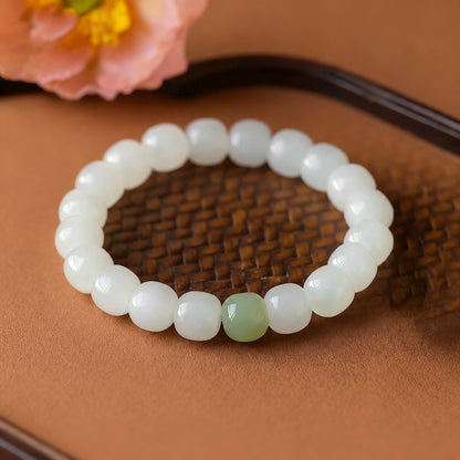 Hetian jade barrel bead bracelet with a green accent