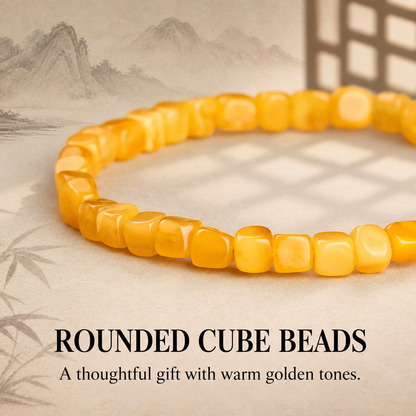 Close-up of honey-yellow amber bead shapes and internal patterns