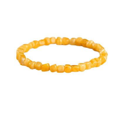 Original honey amber bracelet on white background