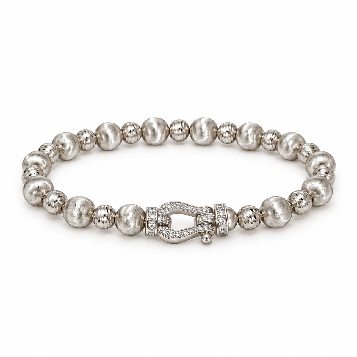 Silver-tone textured bead bracelet with horseshoe accent on white