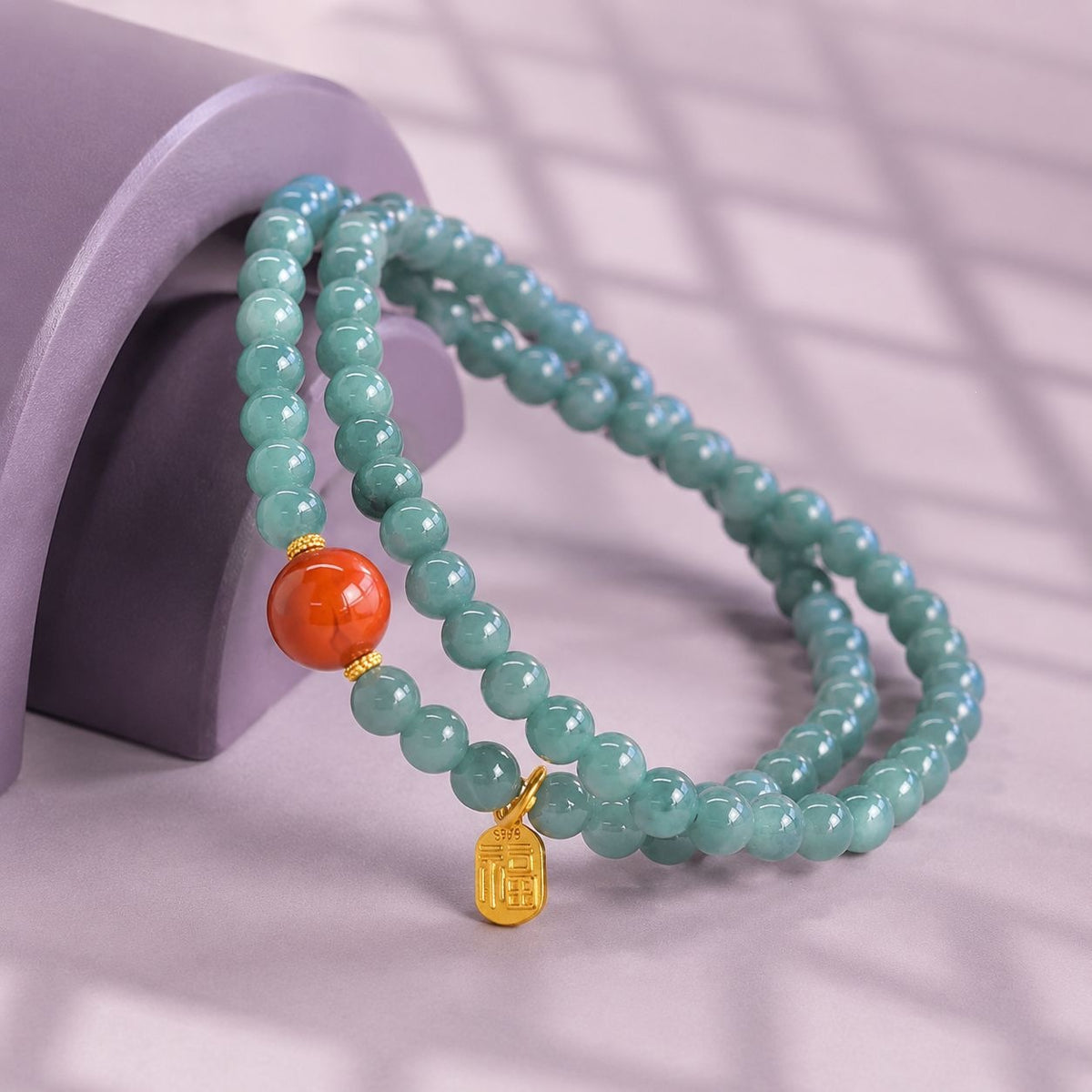 Blue-green jadeite and nanhong agate bracelet with gold-colored Fu charm