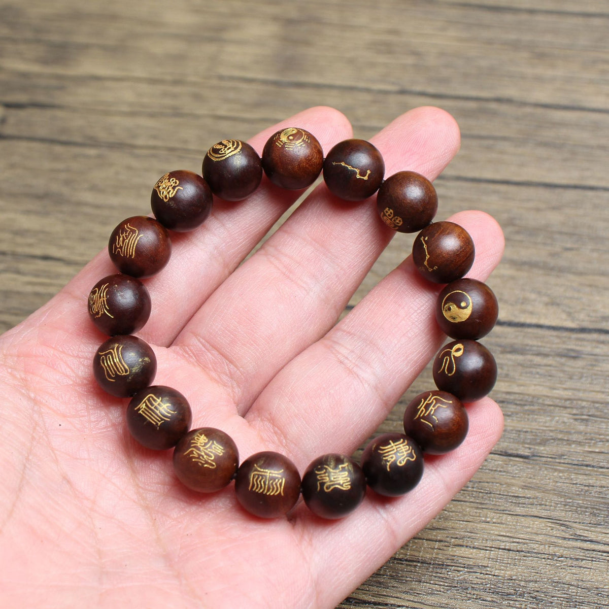 Jujube wood bead bracelet resting on a hand