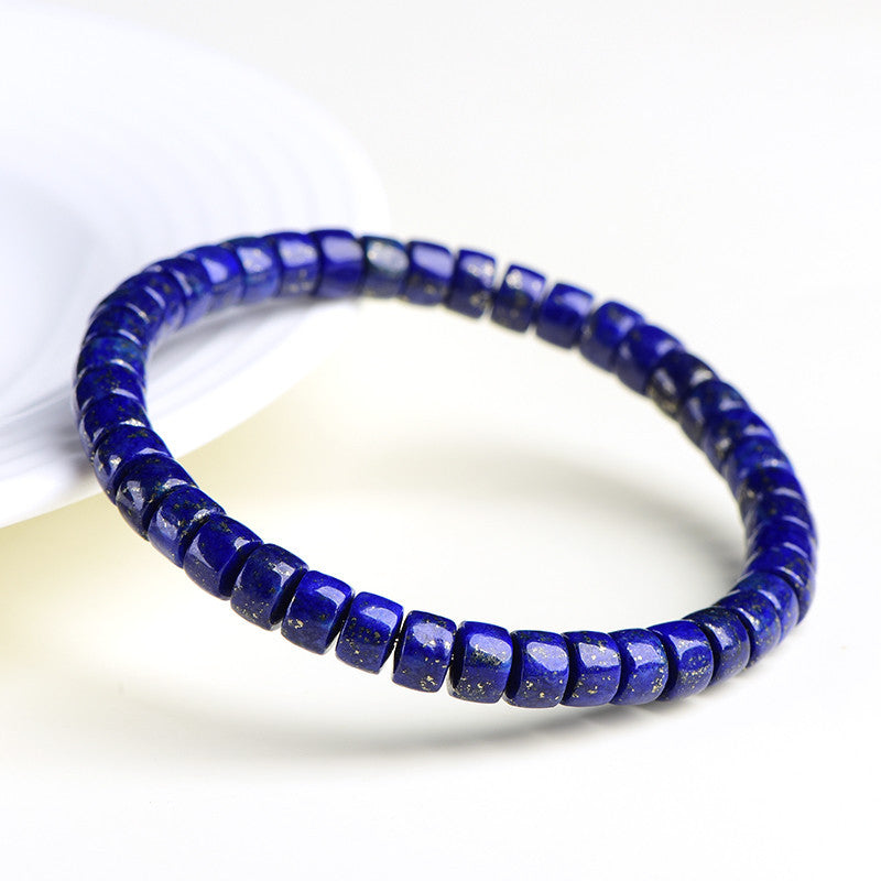 Angled view of deep blue lapis lazuli disc bead bracelet