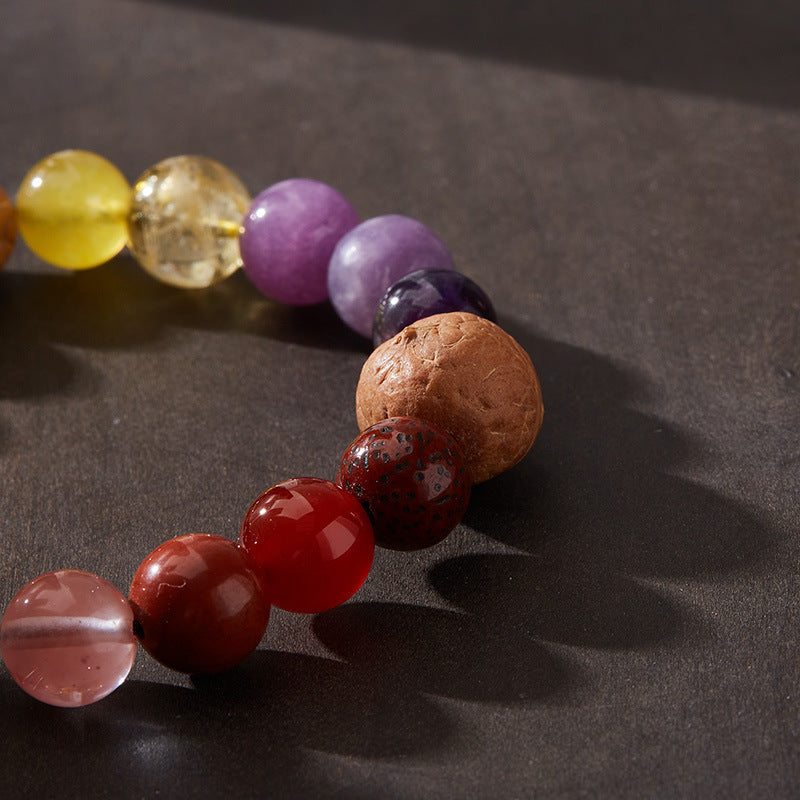Close-up of colored stone beads and textured large bodhi seed