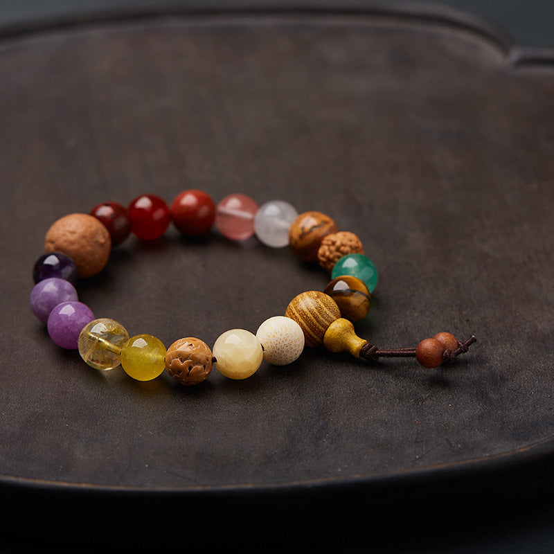 Mixed stone bracelet showing wooden tower and two cord tails