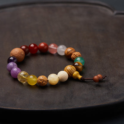 Mixed stone bracelet showing wooden tower and two cord tails