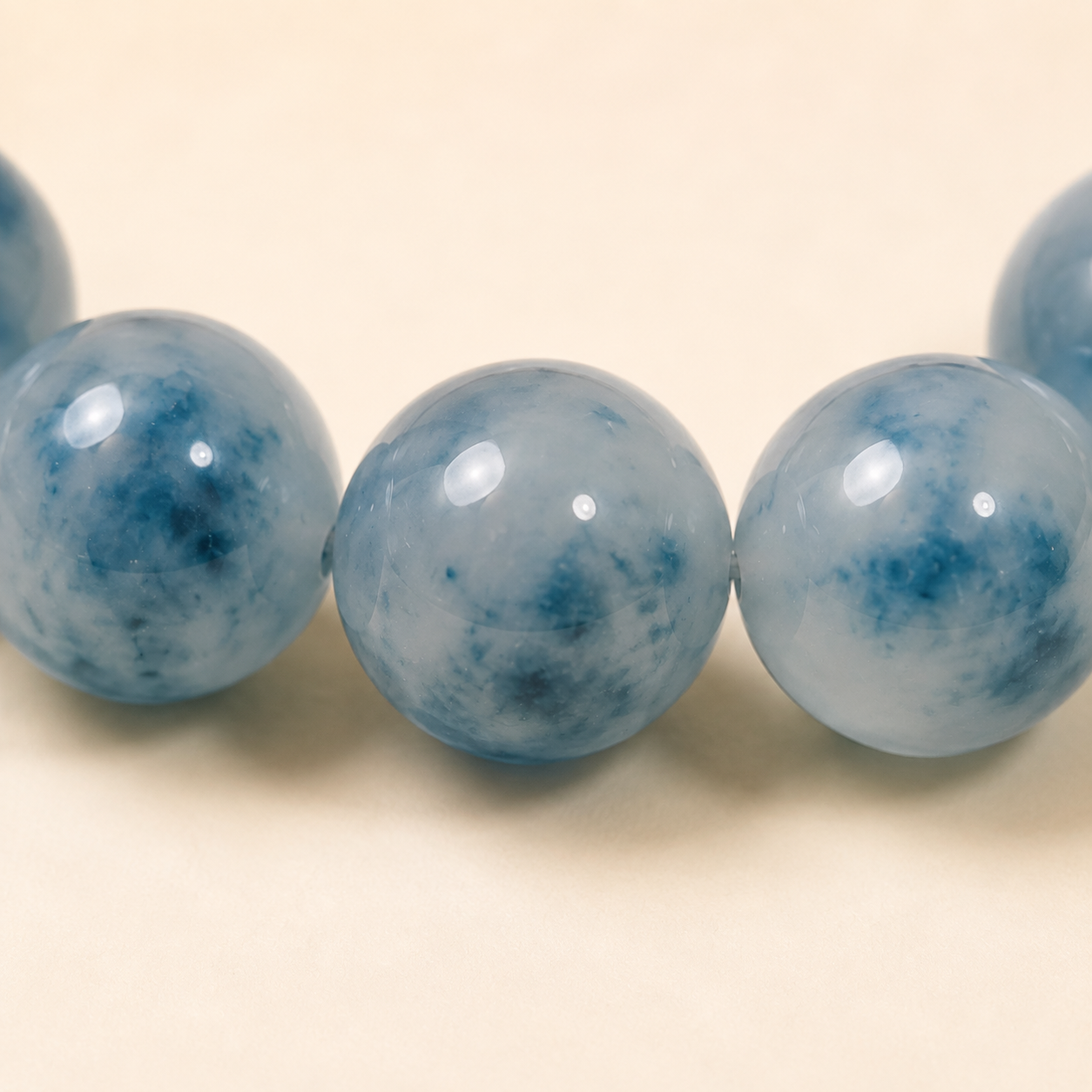 Natural icy blue water jadeite floating flower bracelet – bead texture macro