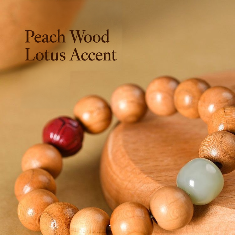 Close-up of wood grain and lotus accent on a peach wood bracelet