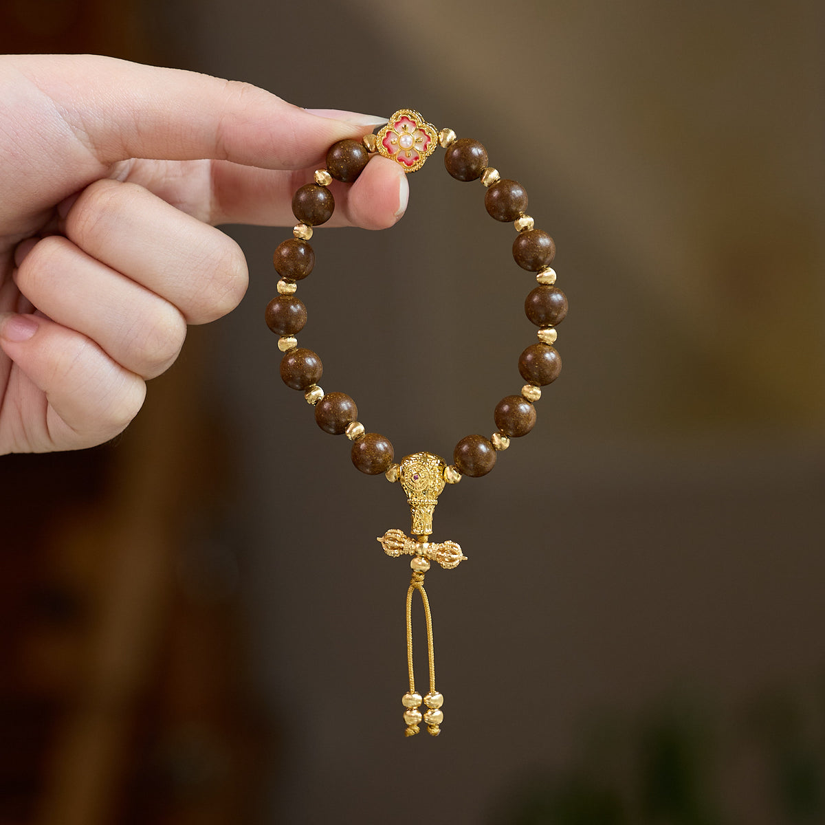 Pear incense bracelet held in hand