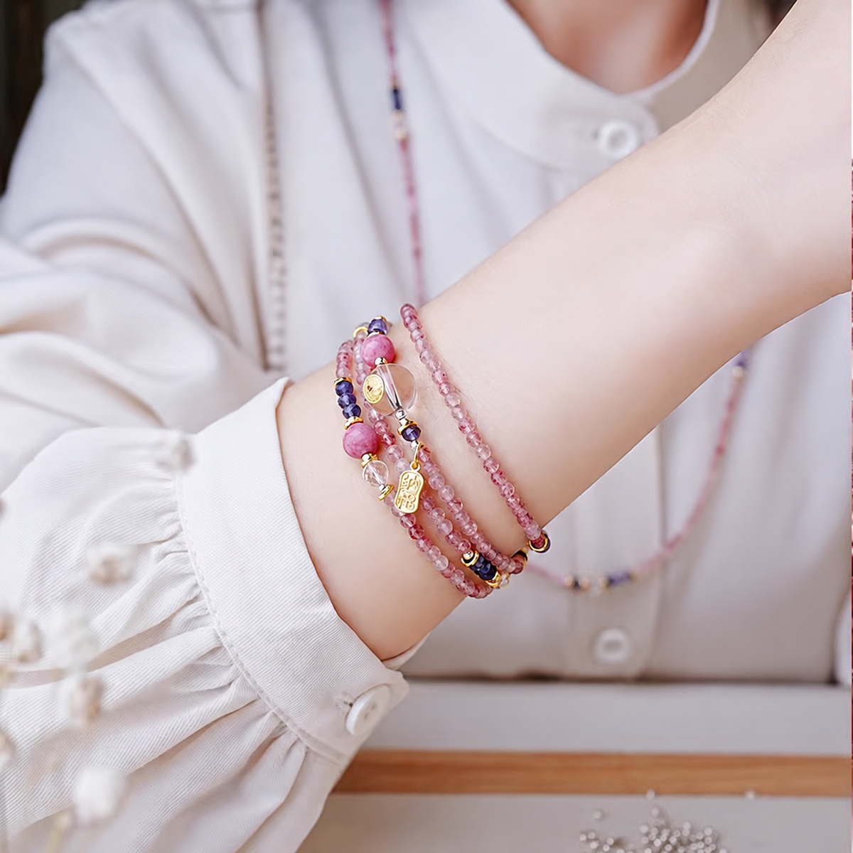 Pink crystal bracelet worn on wrist