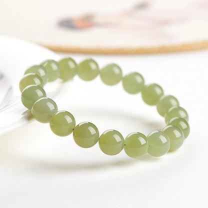 Light green Hetian jade bracelet with polished round beads