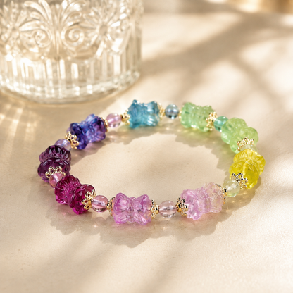 Natural Rainbow Fluorite Lotus Bracelet – diagonal glass-bottle still life
