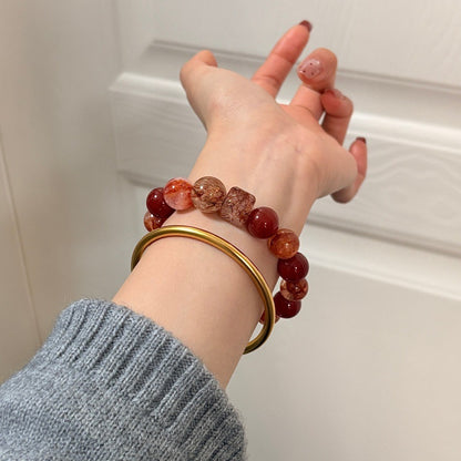 Red agate and inclusion quartz bracelet original lifestyle photograph 3