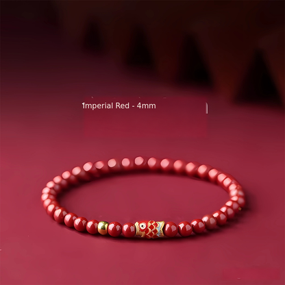 Imperial red 4mm bracelet with gold-tone bead and koi accent