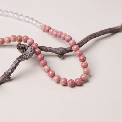 Natural pink stone bead grain close-up