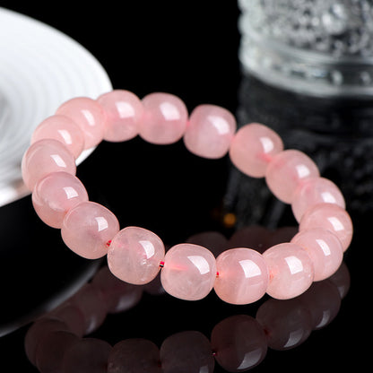 Natural pink rose quartz barrel bead bracelet — angle