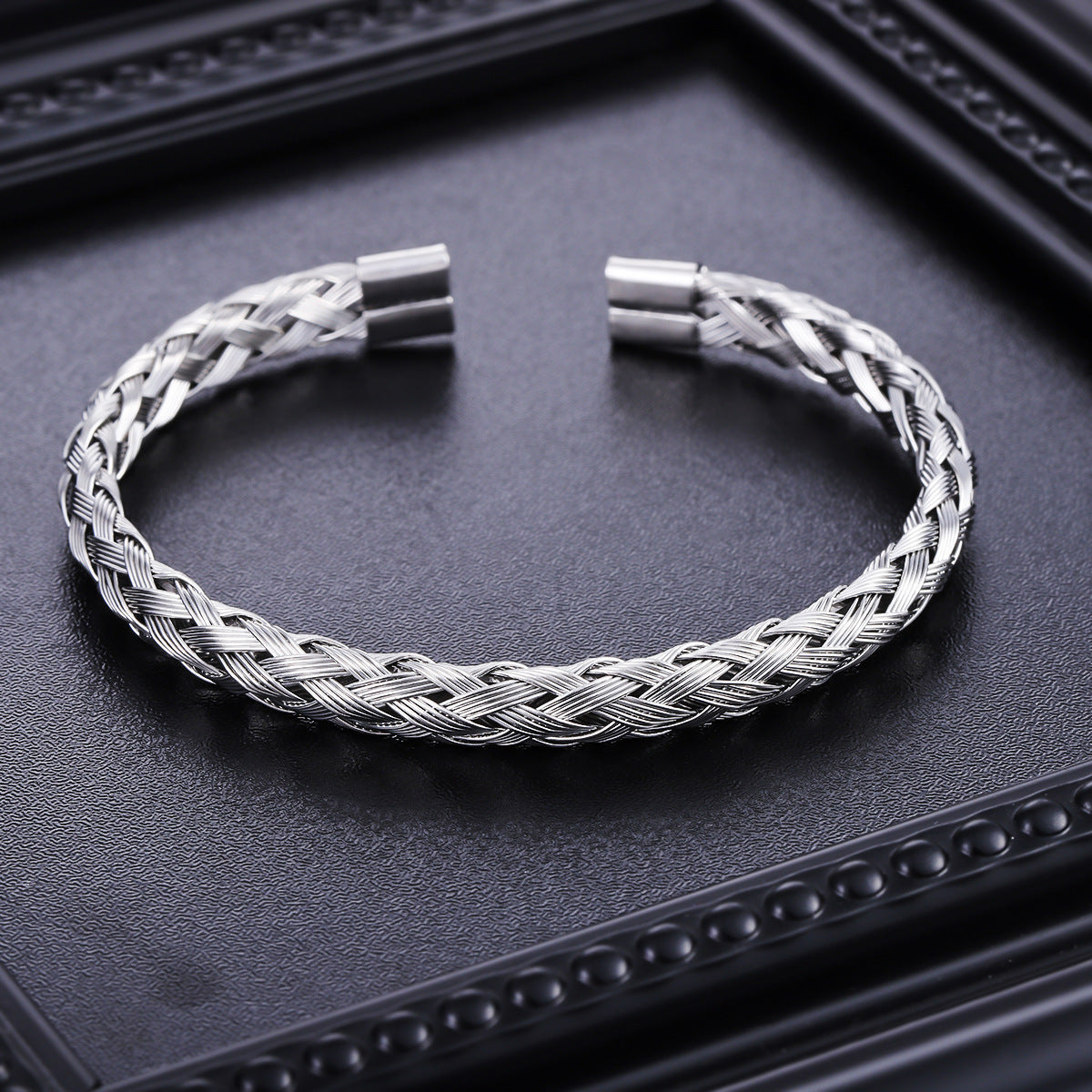 Original detail of braided stainless steel open cuff bracelet