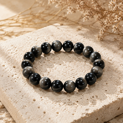 7A Silver Sheen Obsidian Bracelet – Multi-Size – travertine and dried-flower still life