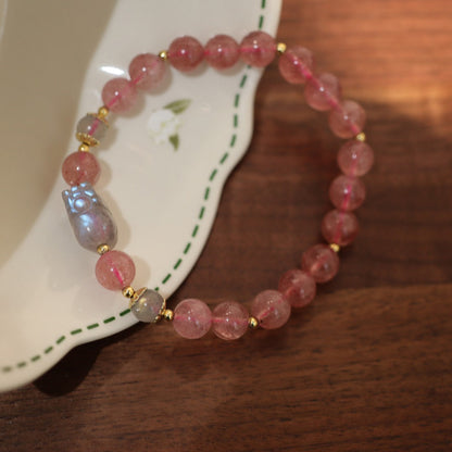 Side view of strawberry quartz and moonstone Pixiu bracelet