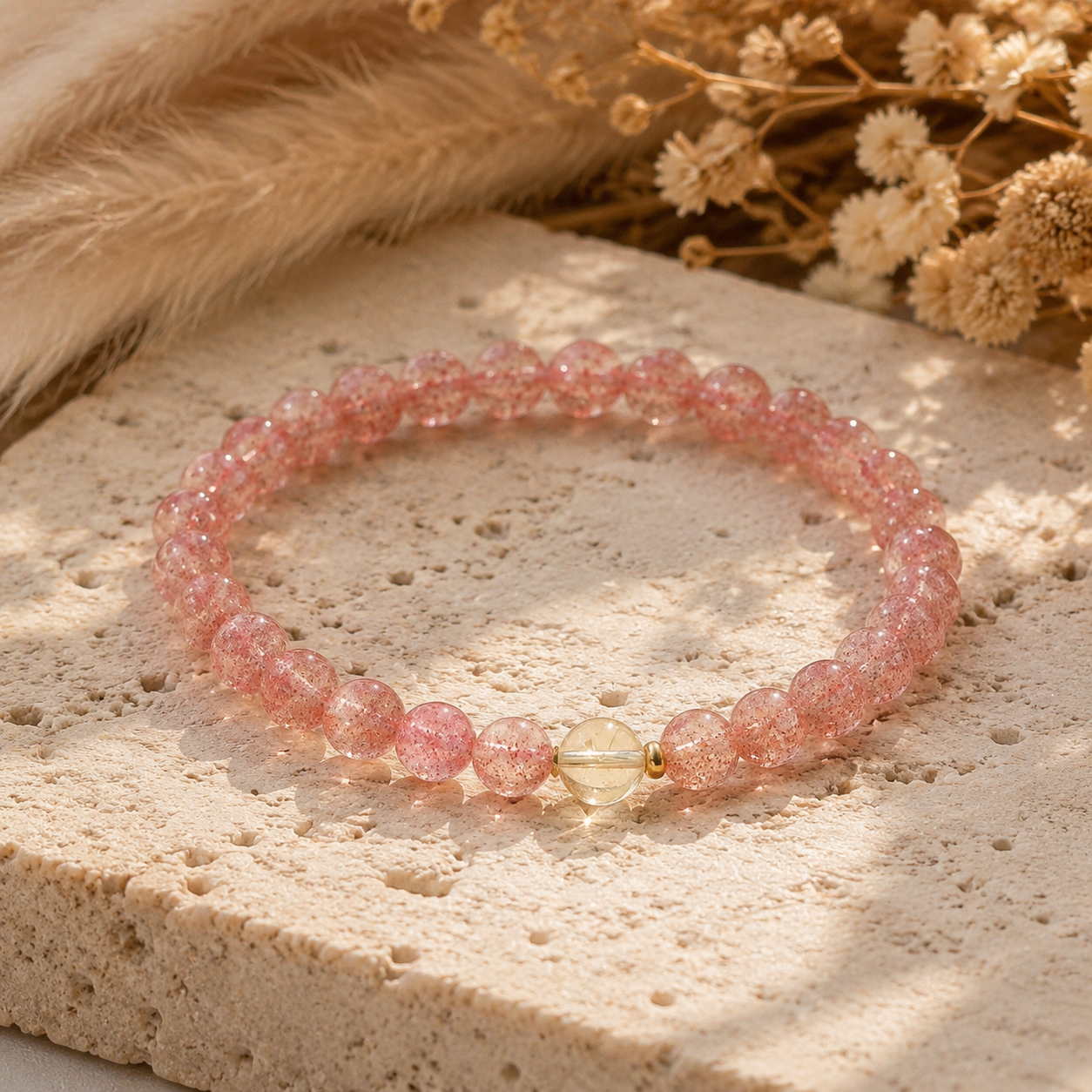 Strawberry Quartz & Citrine Bracelet – 6mm – travertine and dried-flower still life