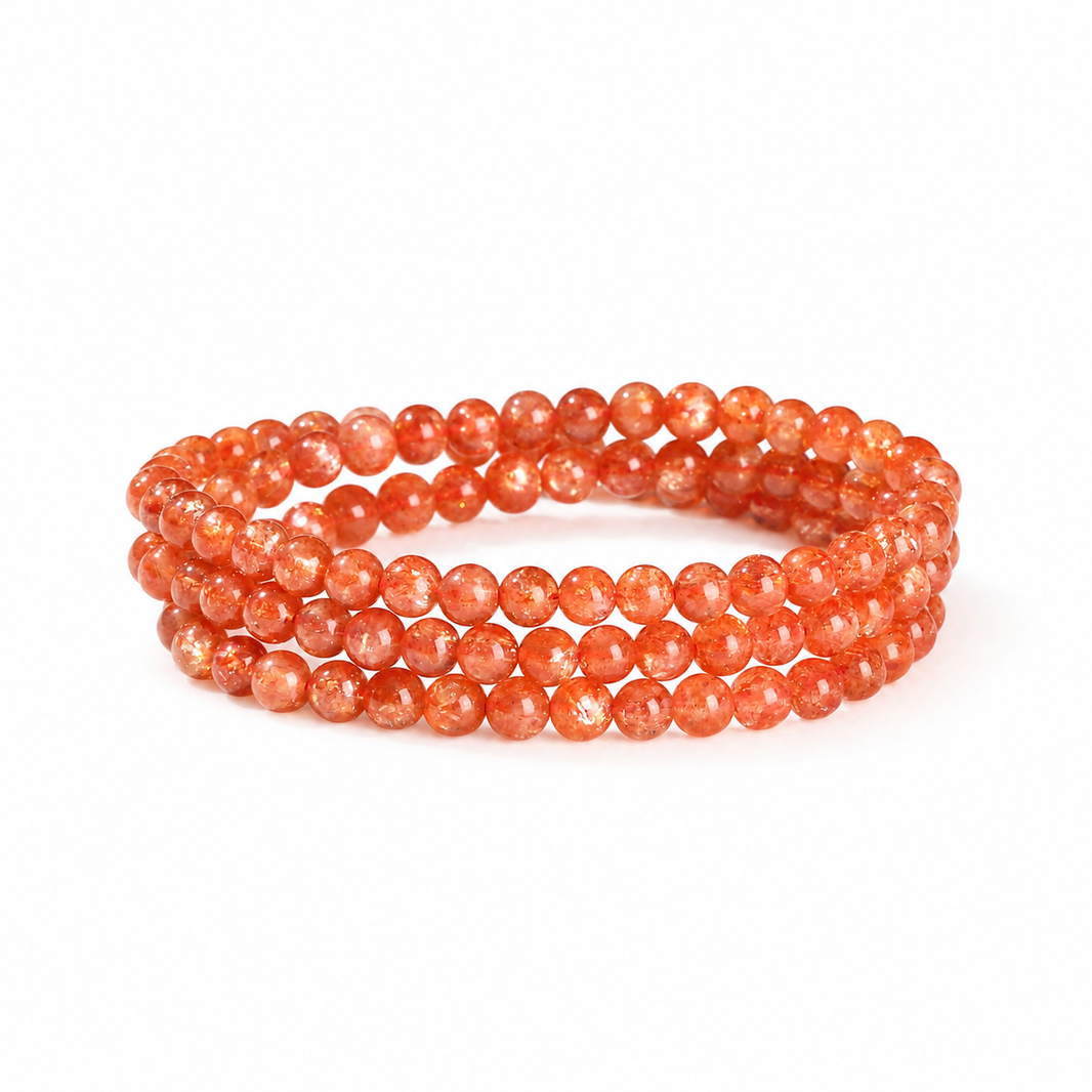Natural orange sunstone triple-wrap bracelet on white