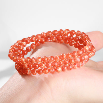 Sunstone triple-wrap bracelet displayed on a hand