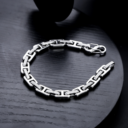 Angled view of the silver-tone geometric link bracelet