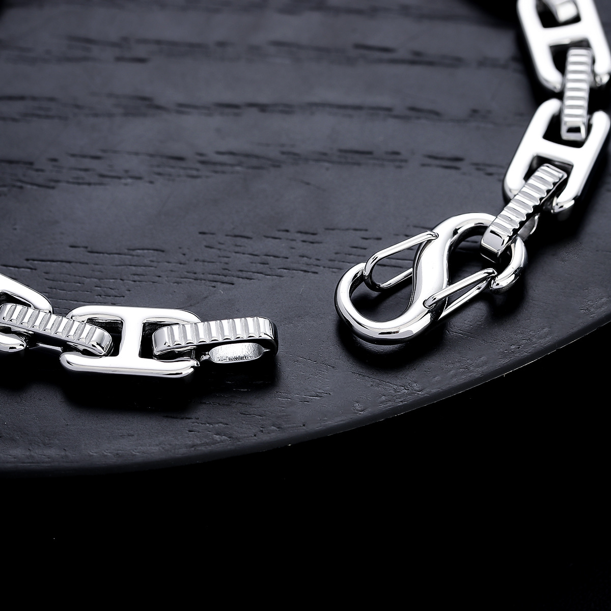 Close-up of the hook clasp and textured links