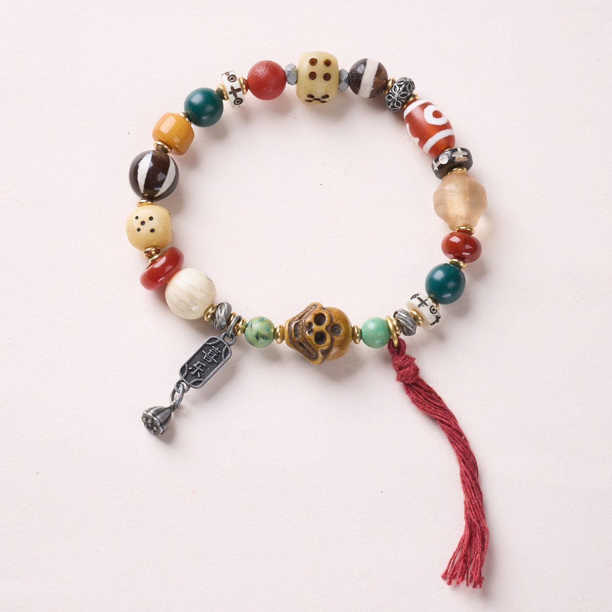 Bone Mix – Dzi, Skull & Red Tassel bracelet