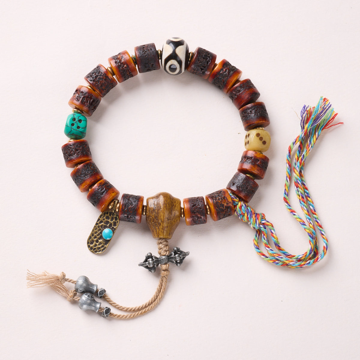 Bone Mix – Dzi, Dice & Vajra Tassel bracelet