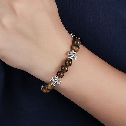 Second wrist view of cross accent tiger eye bracelet
