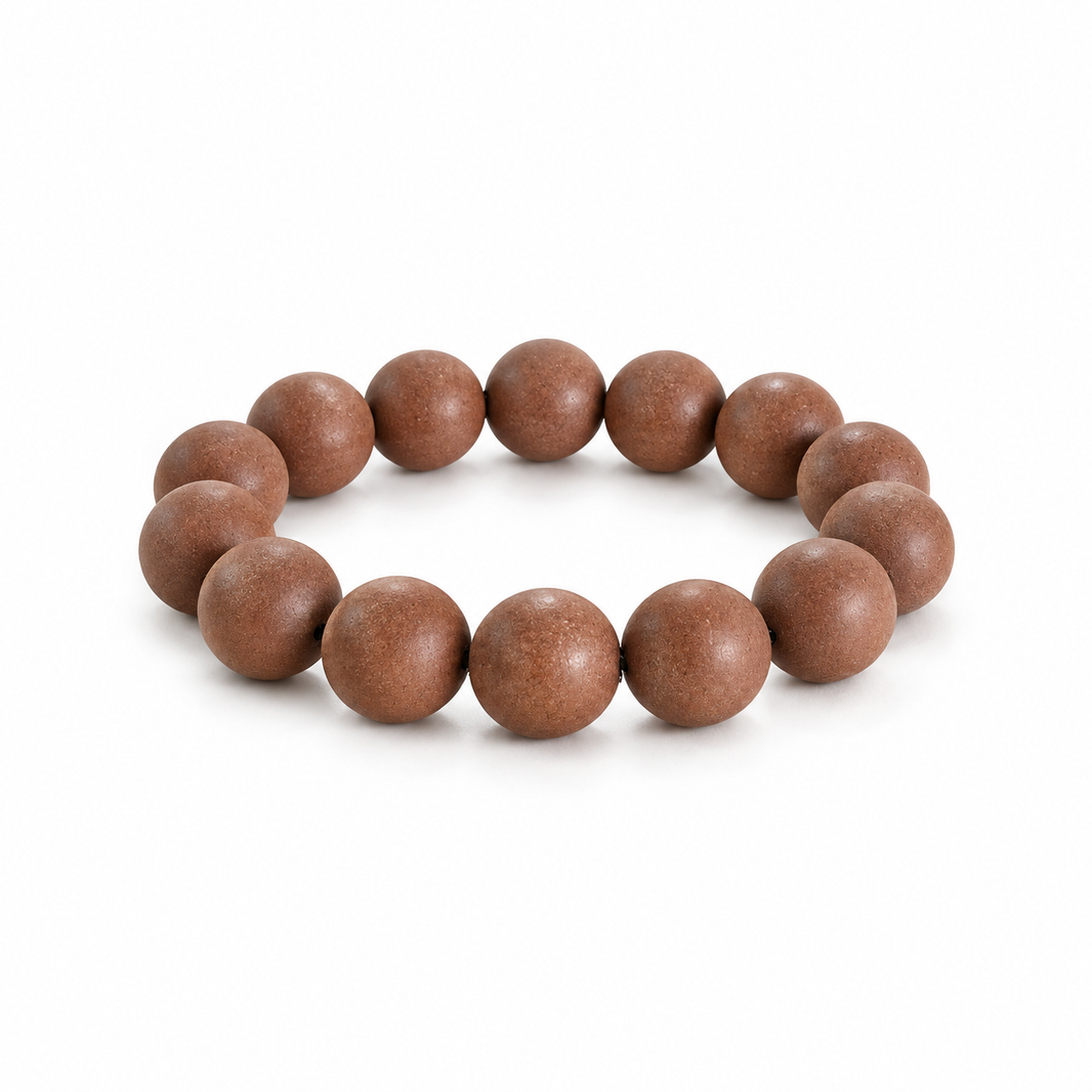 Traditional brown incense bead bracelet on white background