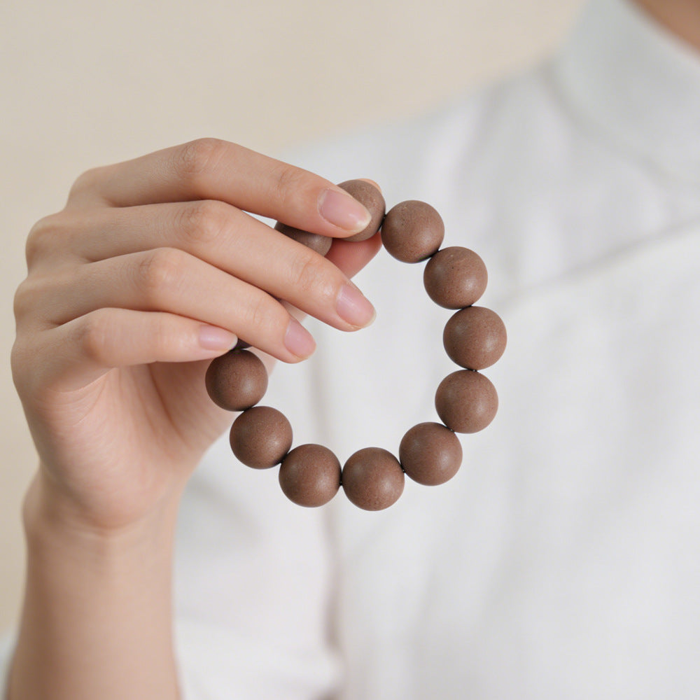 18mm incense bead bracelet held in hand