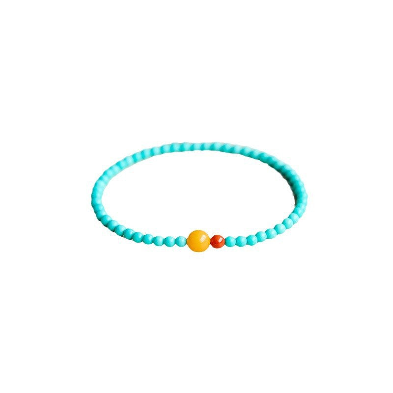 Complete single-loop turquoise and amber bracelet on white