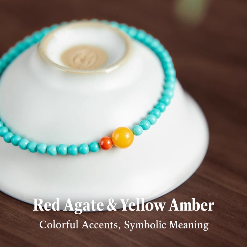 Close view of turquoise beads with yellow amber and red agate accents