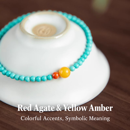 Close view of turquoise beads with yellow amber and red agate accents
