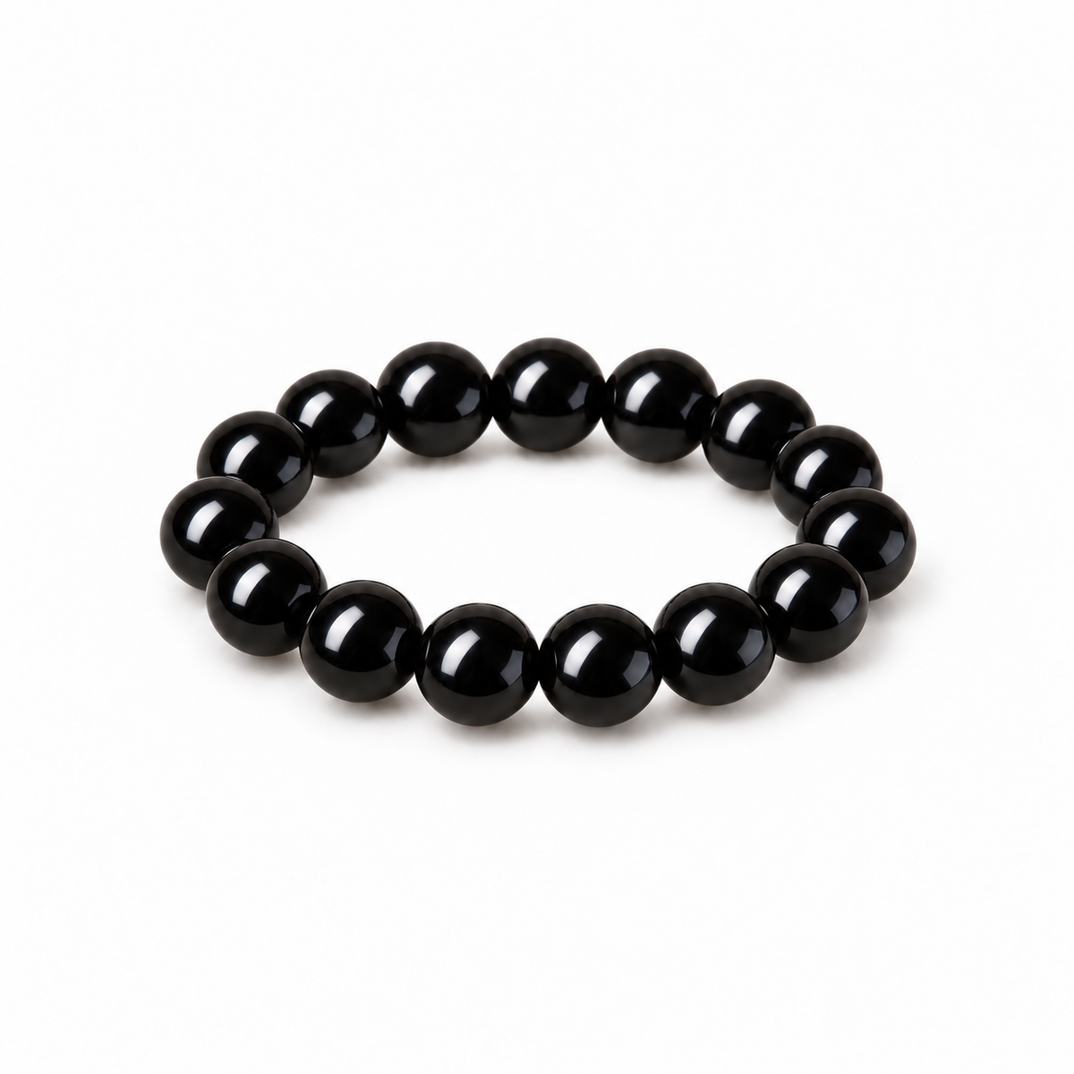 Glossy jet-black obsidian round bead bracelet on white
