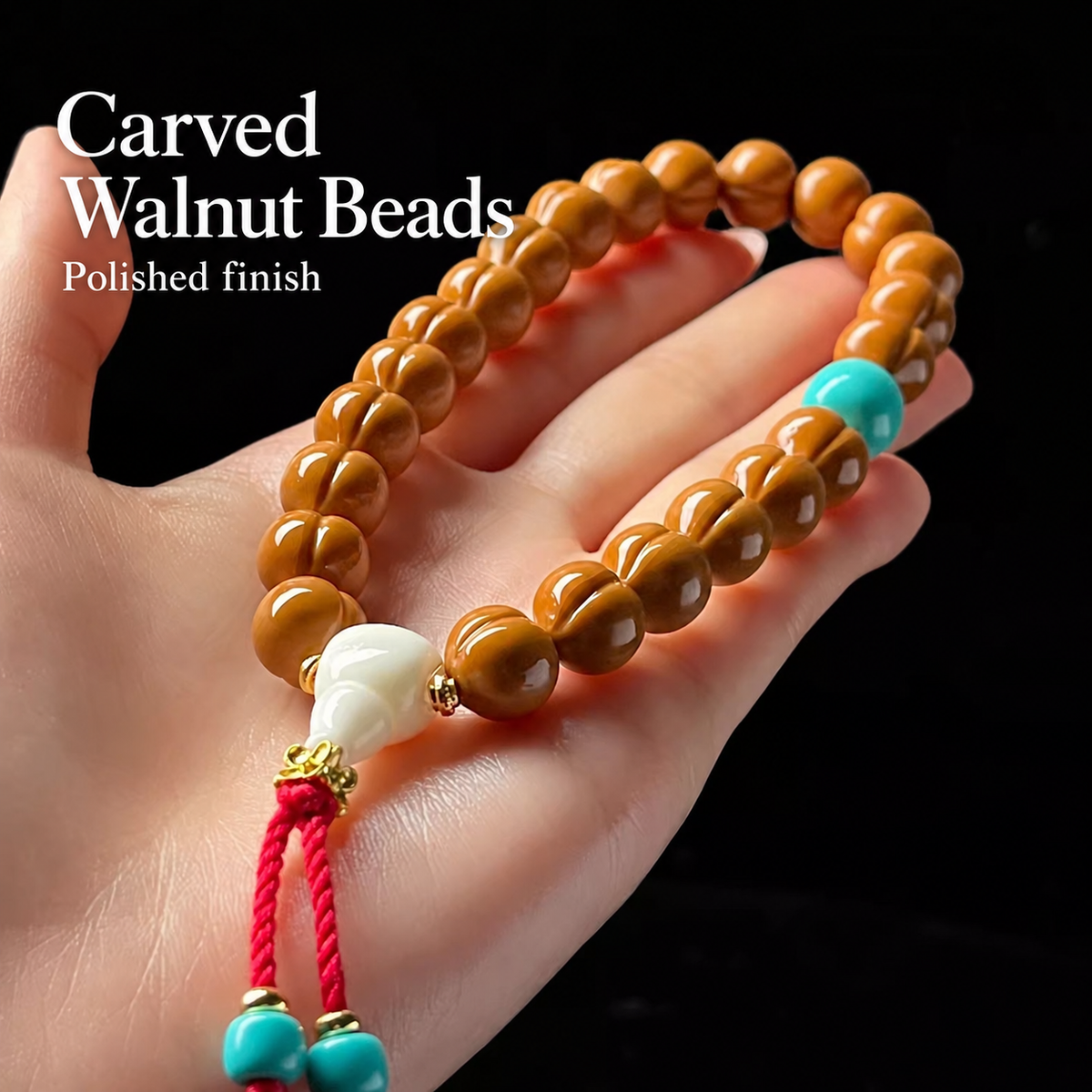 Walnut hand strand with white charm and blue accents, detail