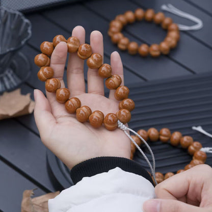 Polished walnut hand strands outdoors